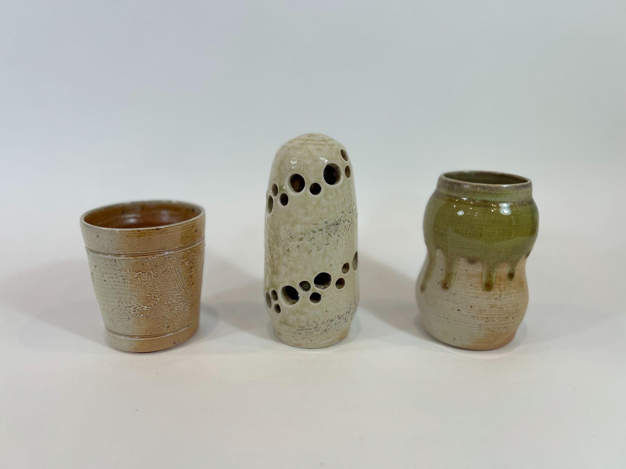 Three wood-fired pieces with different surface colors